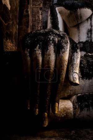 Photo for Public place, Buddha Statue at the historical sites ancient temple ruins Wat Si Chum and Wat Mahathat city of Sukhothai Historical Park, Sukhothai province, Thailand - Royalty Free Image