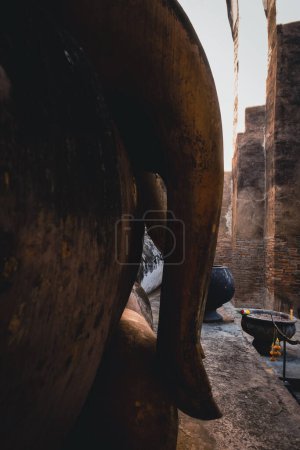 Photo for Public place, Buddha Statue at the historical sites ancient temple ruins Wat Si Chum and Wat Mahathat city of Sukhothai Historical Park, Sukhothai province, Thailand - Royalty Free Image