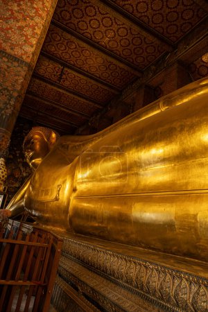 Photo for Wat Phra Chetuphon Wimon Mangkhalaram Rajwaramahawihan, commonly known as Wat Pho, is a renowned Buddhist temple in Bangkok, Thailand. Famous for the Reclining Buddha statue and architectural beauty - Royalty Free Image