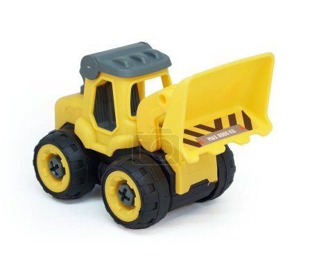 Photo for Yellow plastic bulldozer toy isolated on white background. heavy construction vehicle toy. - Royalty Free Image