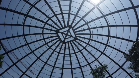 Photo for View inside a large aviary dome with curved steel in the form of dome - Royalty Free Image