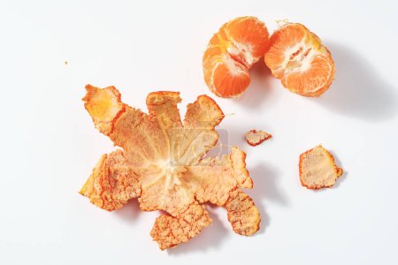 Photo for Background in the form of peeled tangerine as a concept of natural vitamins running GMOs - Royalty Free Image