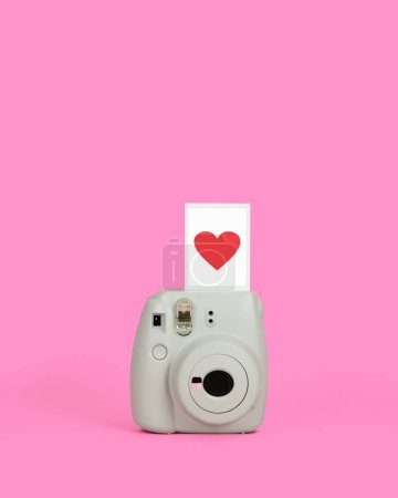 Photo for Instant Film Camera with a Red Heart Exposure. Valentine's Day Love with Copy Space. - Royalty Free Image
