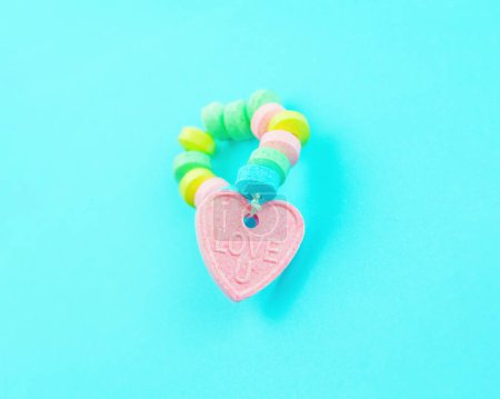 Photo for Love You Heart Candy Bracelet on Blue Background - Royalty Free Image