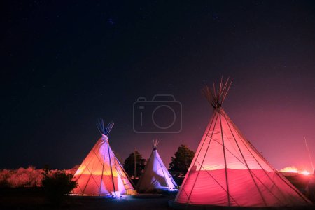 Photo for Teepee's glowing at night in Marfa, Texas - Royalty Free Image