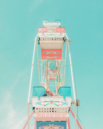 Photo for Ferris Wheel daytime with pastel colors and nostalgic vibes with film grain - Royalty Free Image