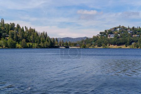 Photo for View of the water, shoreline, and mountains at Lake Gregory Regional Park in Crestline, California - Royalty Free Image