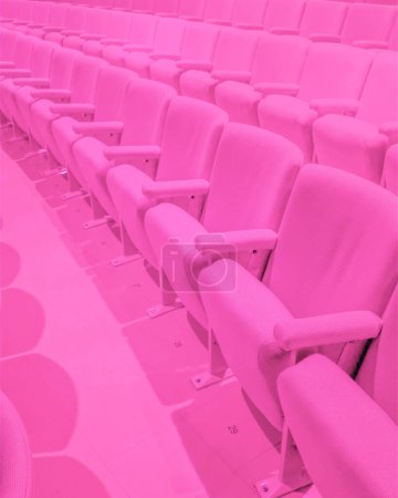 Photo for Rows of empty pink theater seats - Royalty Free Image