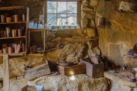 Photo for Interior of rustic Eagle Cliff Mine cabin at Joshua Tree National Park, California with bottles and cans - Royalty Free Image