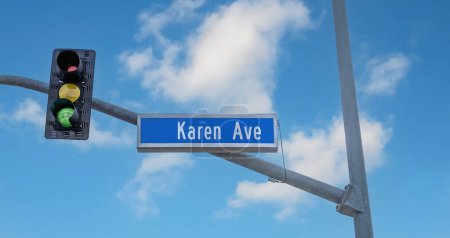Blue Karen Ave street sign on a traffic signal pole with a blue sky