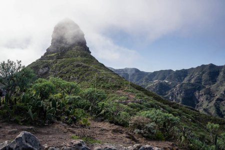 Photo for View of the Taborno mountain in National Park Anaga, Tenerife, Canary Islands, Spain. Roque de Taborno. Top of the Taborno mountain in clouds. - Royalty Free Image