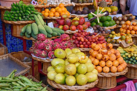 Photo for Fruit market, Machico, Madeira, Portugal, Europe. Exotic fruit in wicker baskets. Bananas, passion fruit, dragon fruit. - Royalty Free Image