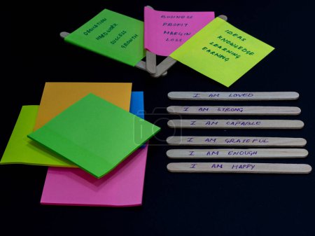 Handwritten motivational quotes on sticky notes for boosting self esteem.