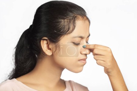 indian women sneezing nose or paranasal sinus due to fever