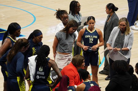 Photo for July 28, 2023, Arlington, Texas, United States: Dallas Wings players listen to coach Latricia Trammell during the WNBA game between the Dallas Wings and the Washington Mystics at College Park Center - Royalty Free Image