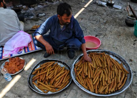 Photo for June 15,2023, Srinagar Kashmir, India : A chef prepares wazwan ( Kashmiri traditional food) during a mass marriage event in Srinagar - Royalty Free Image