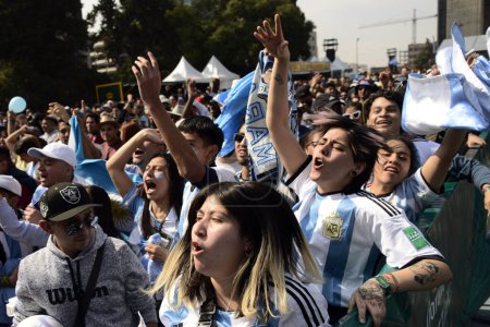 Photo for December 18, 2022, Mexico City, Mexico: Argentine fans celebrate Argentina as new World Champion of the FIFA World Cup at the FIFA Fan Fest at the Monument to the Revolution - Royalty Free Image