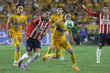 Photo for May 25, 2023, Monterrey, Mexico: Sebastin Cordova of Tigres of UANL  and Alan Mozo of Chivas fight the ball during the Closing Tournament Final match, between Tigres of UANL and Chivas of Guadalajara of the Football MX League at University Stadium - Royalty Free Image