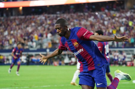Photo for July 29, 2023, Arlington, Texas, United States: Barcelona's Ousmane Dembele celebrates his first period goal during the Soccer Champions Tour game between Barcelona and Real Madrid played at AT&T Stadium - Royalty Free Image