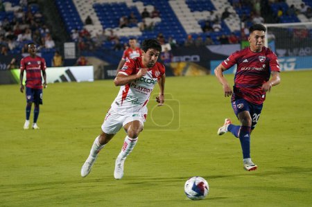 Photo for July 25, 2023, Fisco, United States: Necaxa's Vicente Poggi chases after the ball against Alan Velasco from Dallas during the Leagues Cup match between FC Dallas and Necaxa at Toyota Stadium - Royalty Free Image