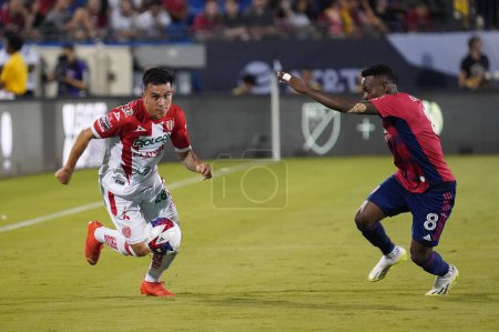 Photo for July 25, 2023, Fisco, United States: Necaxa's Cristian Gonzalez goes after the ball against Jader Obrian from Dallas during the Leagues Cup match between FC Dallas and Necaxa at Toyota Stadium - Royalty Free Image