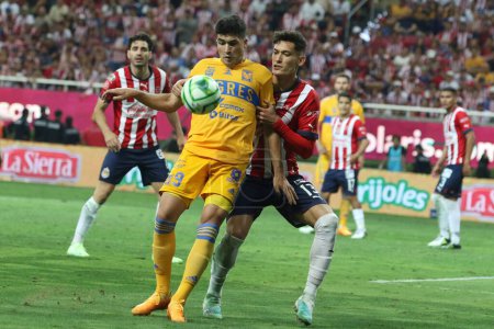 Photo for May 28, 2023, Jalisco, Mexico: Jess Orozco of Chivas of Guadalajara and Nicols Ibez of Tigres of Nuevo Leon fight for the ball during the second leg match of the Mexican football final of the  MX League Closing tournament 2023 at Akron stadium - Royalty Free Image