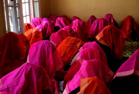 Photo for June 15,2023, Srinagar Kashmir, India : Muslim brides gather in a room during a mass marriage event in Srinagar.  At least 61 sets of couples participated in the mass marriage event organized by 'We the helping hands foundation' - Royalty Free Image