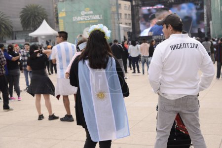 Photo for December 18, 2022, Mexico City, Mexico: Argentine fans attend the FIFA Fan Fest at the Monument to the Revolution to support their team in the FIFA World Cup final against the French team. on December 18, 2022 in Mexico City, Mexico - Royalty Free Image