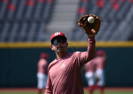 Photo for March 27, 2023, Mexico City, Mexico: Juan Carlos Gamboa catches the ball during the training of  the Diablos Rojos de Mexico baseball team at Alfredo Harp Helu Stadium - Royalty Free Image