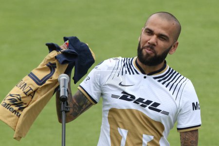 Photo for July 23, 2022, Mexico City, Mexico: Brazilian Dani Alves receives his official Pumas' jersey during his presentation as a new member of the Pumas UNAM soccer club, on the pitch at the Pumas training facility - Royalty Free Image