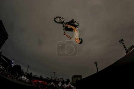 Photo for A young man does stunts on a bicycle - Royalty Free Image