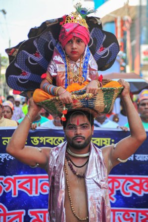 Photo for 06 September 2023 Sylhet-Bangladesh: Young Children dress up as Krishna during the colorful rally of Krishna Janmashtami event todays in Sylhet, Bangladesh. Janmashtami is celebrated by Hindu devotees to mark the birth anniversary of Lord Krishna - Royalty Free Image