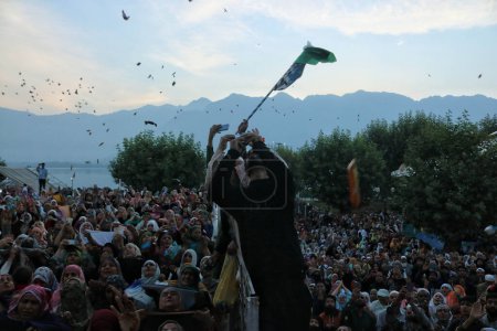 Photo for Srinagar Kashmir, India - September 29,2023: people pray as head cleric  displays holy relic on occasion of Mawlid-un-Nabi or Prophet Muhammad birth anniversary in Dargah Hazratbal shrine in Srinagar - Royalty Free Image