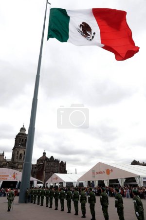 Photo for October 15, 2023, Mexico City, Mexico: Members of the Mexican Army lower the monumental flag of Mexico in the Zocalo during the XXIII Zocalo International Book Fair in Mexico City - Royalty Free Image