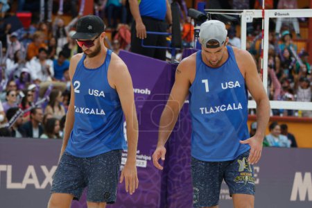 Photo for October 15, 2023, Tlaxcala, Mexico:  Theo Brunner (L) and Trevor Crabb of  USA   compete against Michal Bryl of Poland  (R)   during the Beach Volleyball World Championship  Men's Bronze Medal Match between USA and POland - Royalty Free Image