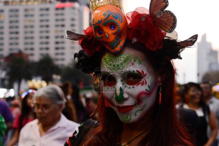 Photo for October 22, 2023, Mexico City, Mexico: A person dressed as 'Catrina' takes part during the Annual Mega Parade of Catrinas 2023 as part of Day of the Dead (Dia de Muertos) celebration at Reforma Avenue - Royalty Free Image