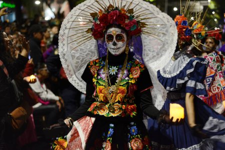 Photo for October 22, 2023, Mexico City, Mexico: A person dressed as 'Catrina' takes part during the Annual Mega Parade of Catrinas 2023 as part of Day of the Dead (Dia de Muertos) celebration at Reforma Avenue - Royalty Free Image