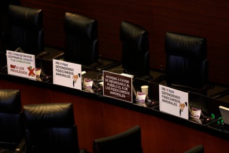 Photo for October 24, 2023, Mexico City, Mexico: Banners were placed in the seats of the senators of the Encuentro Social party in favor of the extinction of the trusts of the Judicial Branch of the Federation in the session in the Senate in Mexico City - Royalty Free Image