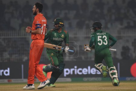 Photo for October 28, 2023, Kolkata, India :  Bangladesh's Mahedi Hasan (R  in action  during the match between Netherlands and Bangladesh of  the 2023 ICC Men's Cricket World Cup at the Eden Gardens Stadium - Royalty Free Image