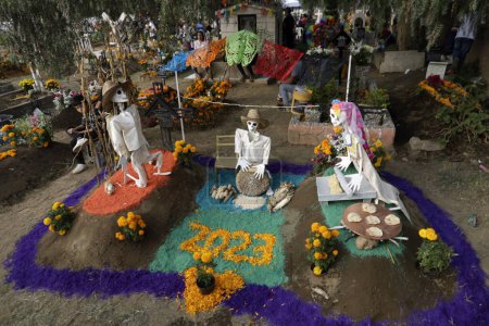 Photo for November 2, 2023, Mexico City, Mexico: The graves of children and adults are decorated with arrangements and gifts on the Day of the Dead holiday at the Pantheon of San Antonio Tecomitl in the Milpa Alta Mayor's Office in Mexico City - Royalty Free Image