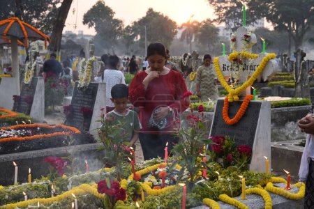 Photo for November 2, 2023, Kolkata, India: Christian devotees attend the pantheons to offer prayers next to the graves of their loves one in a  during 'All Souls Day' in Kolkata - Royalty Free Image