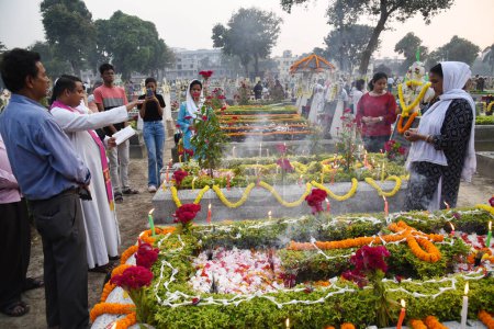 Photo for November 2, 2023, Kolkata, India: Christian devotees attend the pantheons to offer prayers next to the graves of their loves one in a  during 'All Souls Day' in Kolkata - Royalty Free Image