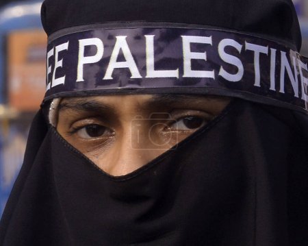 Photo for November 3, 2023, Kolkata, India: Muslim woman take part during a rally to protest against Israel attack on Gaza - Royalty Free Image