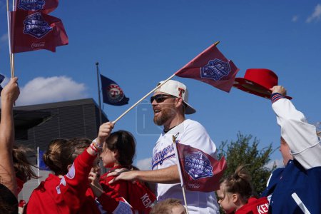 Photo for Arlington, Texas, USA: A member of the Texas Rangers organization, participates in the parade celebrating their 2023 World Series Championship on the streets of Arlington's entertainment district and in front of Globe Life Field on Friday November 3 - Royalty Free Image