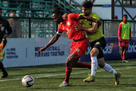 Photo for November 04,2023, Srinagar Kashmir, India : Ahteeb Ahmad Dar (L) of Real Kashmir FC in action against Abraham Okyere (R) of Tiddim Road Athletic Union FC  during the I-League match between Real Kashmir FC vs Tiddim Road Athletic Union FC - Royalty Free Image