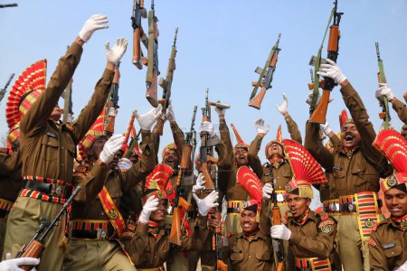 Photo for November 09,2023, Srinagar Kashmir, India : New recruits of the Indian Border Security Force (BSF) toss their rifles to celebrate after their passing out parade in Humhama, on the outskirts of Srinagar - Royalty Free Image