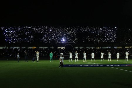 Photo for November 11, 2023, Mexico City, Mexico: Pumas fans turn on lamps and cell phones to make the logo of the UNAM Pumas team during the match of Pumas vs Chivas de Guadalajara of the 2023 Apertura Tournament of the MX League - Royalty Free Image
