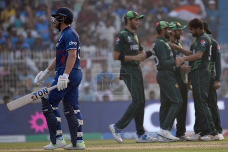Photo for November 11, Kolkata, India: Haris Rauf (R) celebrates with teammate after taking the wicket of Jonny Bairstow of England  during the 2023 ICC Men's Cricket World Cup match between England and Pakistan at the Eden Gardens Stadium - Royalty Free Image