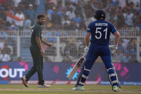 Photo for November 11, Kolkata, India: Haris Rauf of Pakistan (L) celebrates after taking the wicket of Jonny Bairstow of England  during the 2023 ICC Men's Cricket World Cup match between England and Pakistan at the Eden Gardens Stadium - Royalty Free Image