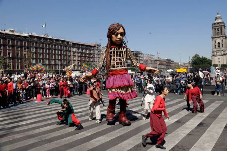 Photo for November 18, 2023, Mexico City, Mexico: Little Amal walks the streets from the Plaza del Zocalo to the Palacio de las Bellas Artes in Mexico City - Royalty Free Image